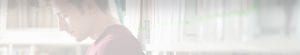student in library header