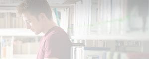 student in library header